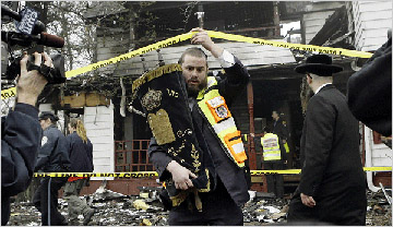 Torah resuced from the Neturei Karta HQ destroyed in an arson attack, April 2007